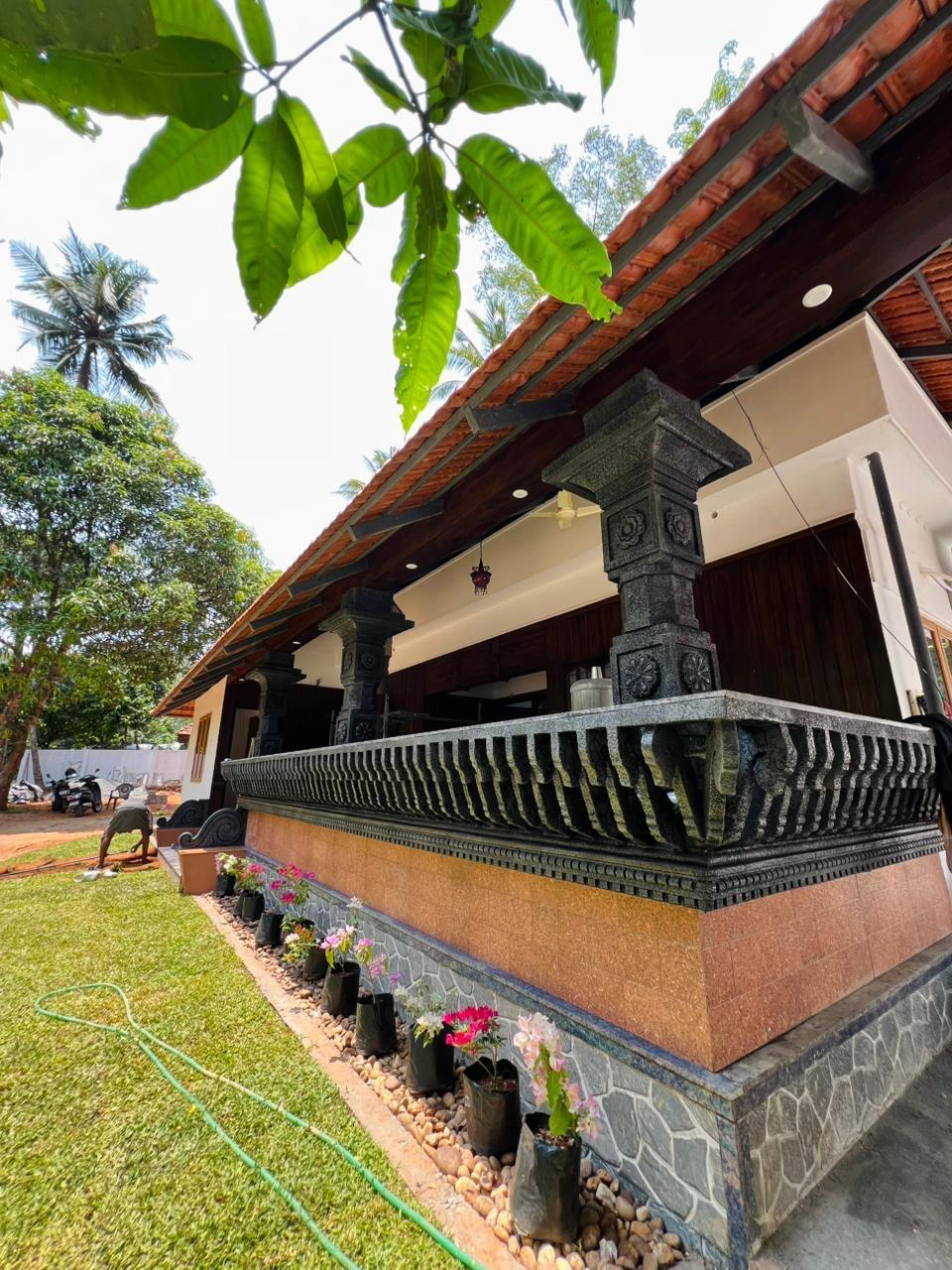 Carved pillars along the front of the house
