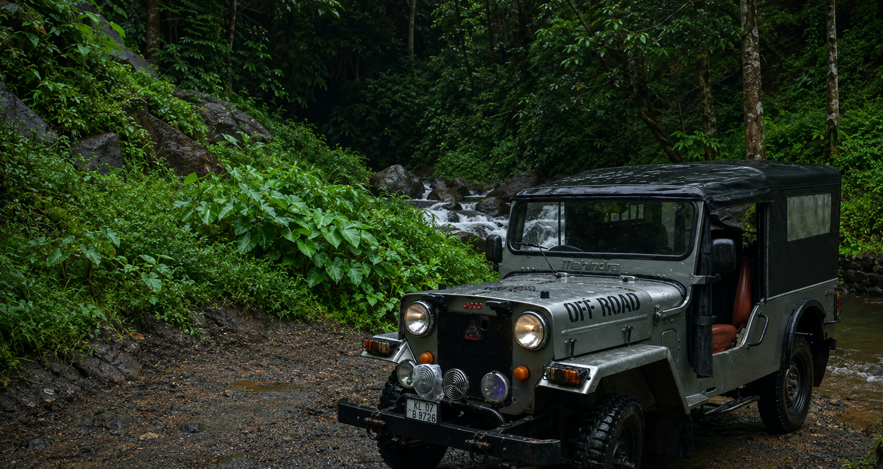 Off-road jeep in a tropical rainforest clearing near a stream