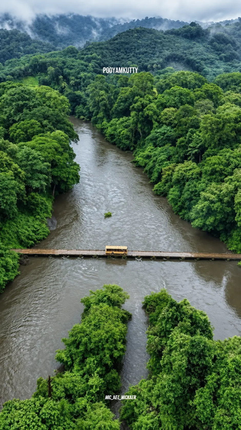 The Pooyamkutty river winding between densely forested hills in the Western Ghats