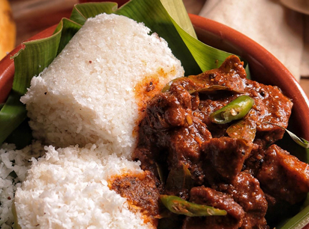 A traditional Kerala meal prepared in a family home kitchen